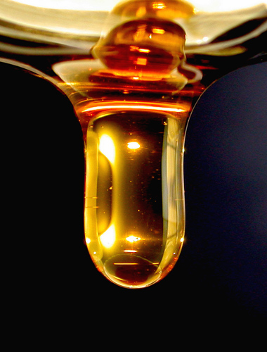 Honey dripping off a spoon