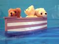 3 Bears in a boat sailing on blue paper seas, bound by brotherhood, seek bulbous blond with Lox.