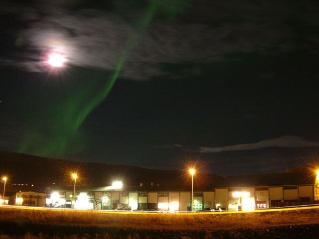 The town, the northern lights, the moon and the space