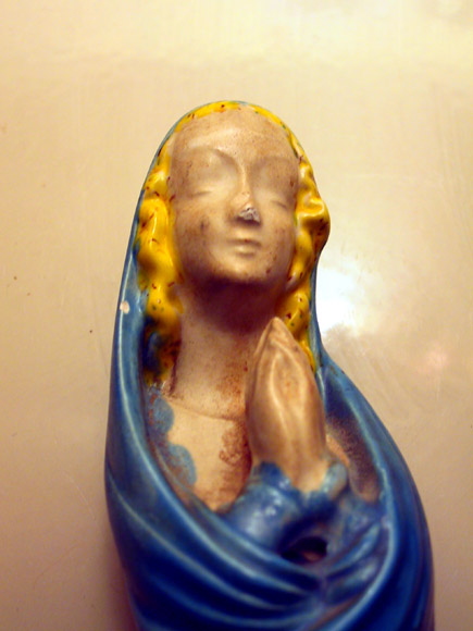 Madonna statue in blue and yellow