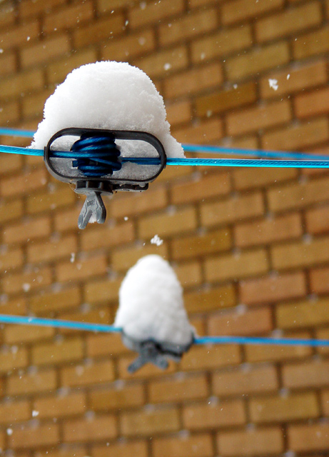 Snow on clothes line