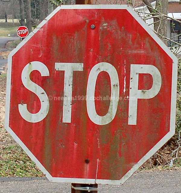 Old stop sign with back up