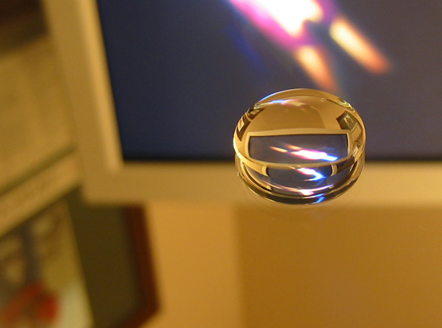 Water Drop on a Mirror in front of my Monitor