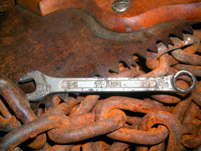 Sears tool , rusty chain and saw