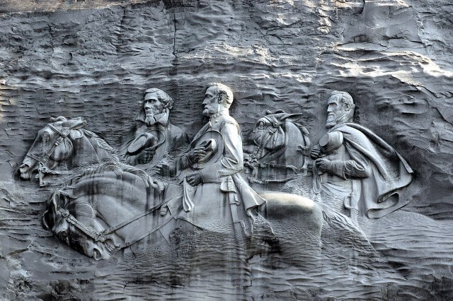 Three Men Carved in a Mountain