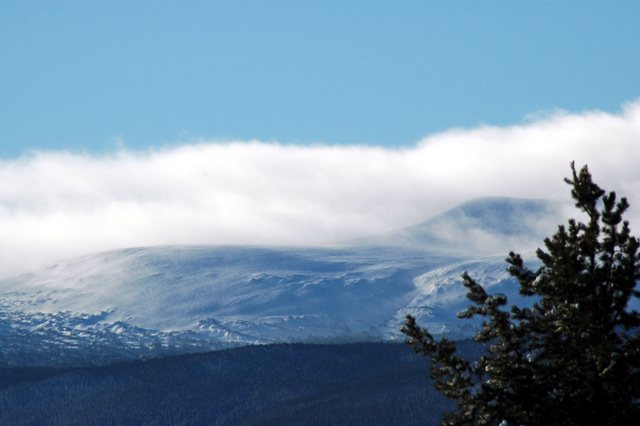 High altitude wind blown clouds and snow