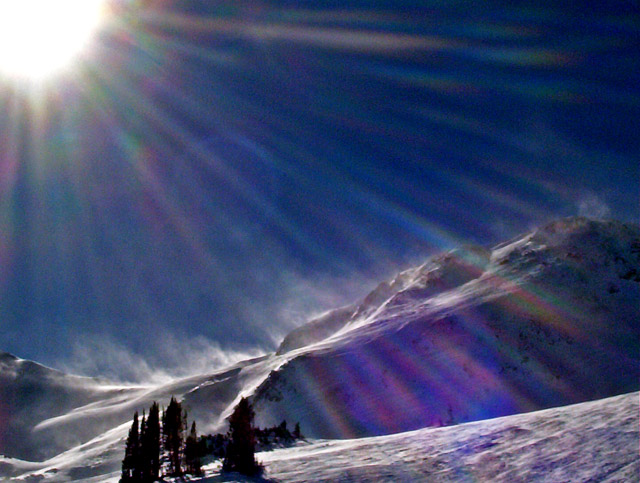 Wind blowing snow off ridge at 12,000' elevation.