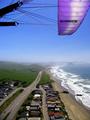 "Hwoo-ya!!"  Cutting thru the Ozone!     (paragliding wing-overs above the beach homes)