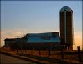 Abandoned Barn and Silo at Sunset