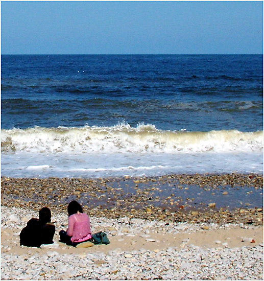 One sky, one sea, one beach, two people.