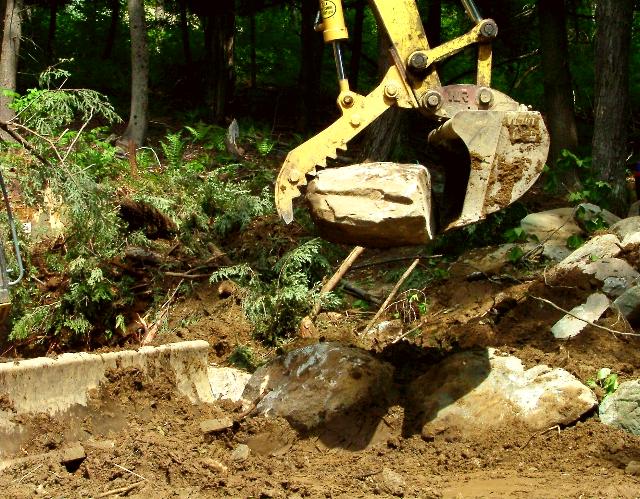 Building a rock wall with "The Claw"