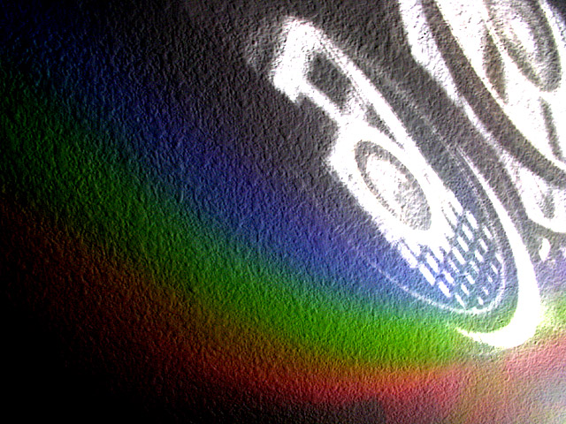 Light Reflection and Refraction from CDs on Stucco Wall