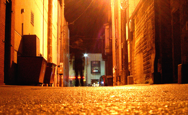 Walking Through the Orange Haze of an Alley