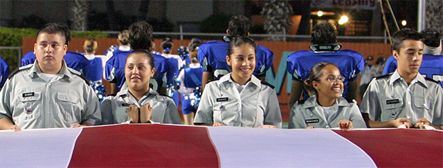 ROTC Members Holding The Flag