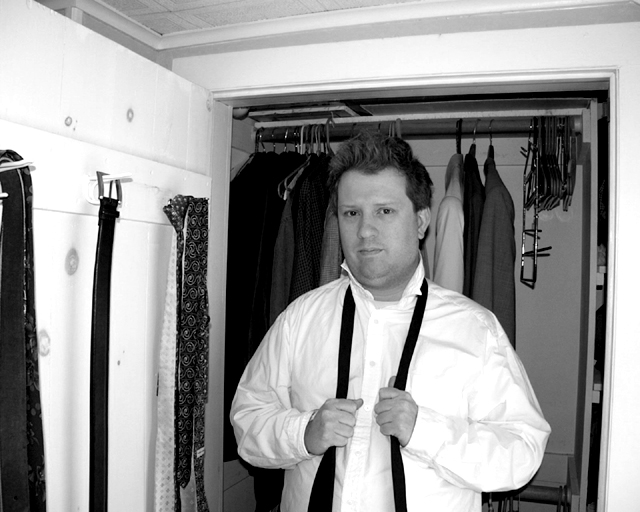 Arbus: Man preparing for funeral, N. J., 2006