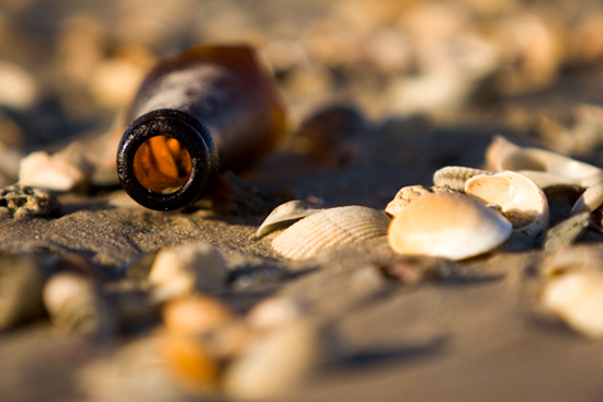 Broken Bottle on shelly beach