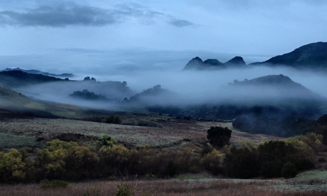 The night crept on to morn with mists in phantom shapes and ghostly form
