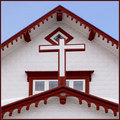 Repousséd iron on a small wooden church