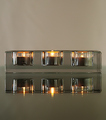 Glass Candle Holder on a Glass Table
