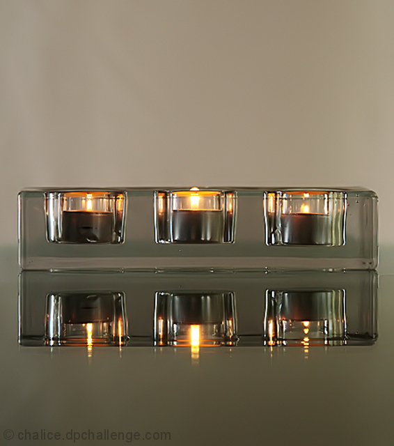 Glass Candle Holder on a Glass Table
