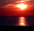 People Watching the Crazy Sunset at the Beach