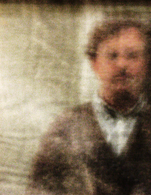 Man with mustache reflected in a full-sized bed sheet