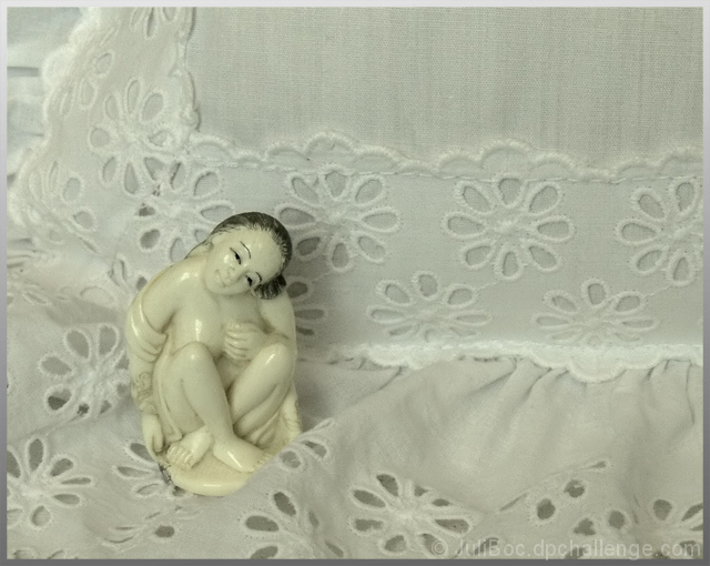 Ivory Netsuke on Old Lace