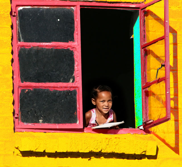Dirty Window..... and a smile despite poverty