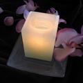A candle and an orchid