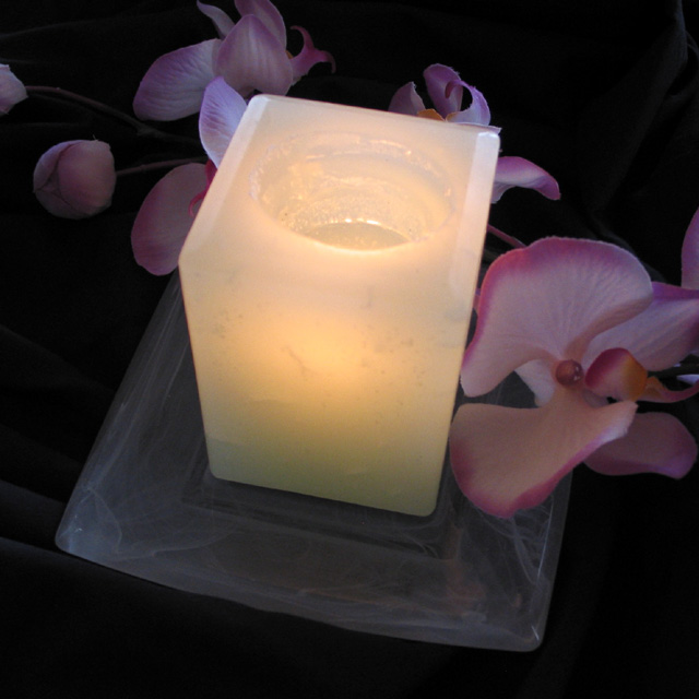 A candle and an orchid