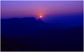 Sun behind the ridges..