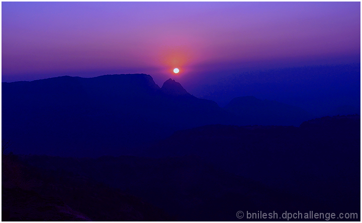 Sun behind the ridges..