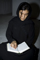 Lady reading Quraan