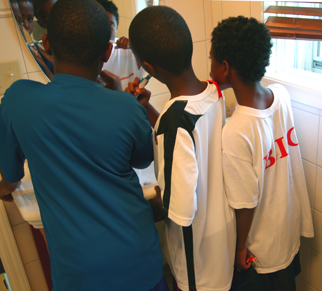 brothers brushing teeth