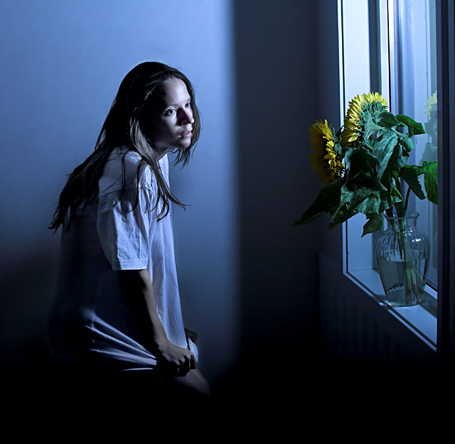 a girl with sunflowers