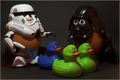 A Spudtrooper marches the captured Rebel Duckies past Darth Tater on the way to their cell