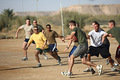 Deployed Marines take time off to enjoy a friendly game of football.