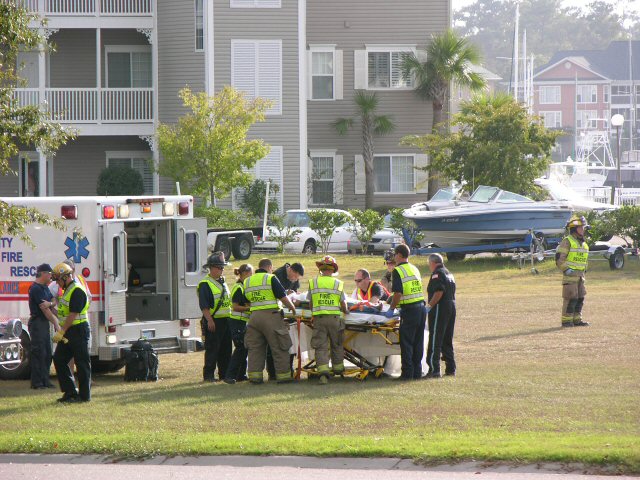 Fire Rescue prepare accident victim for transport