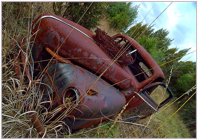 Abandoned Getaway Car with Barbed Wire Topping