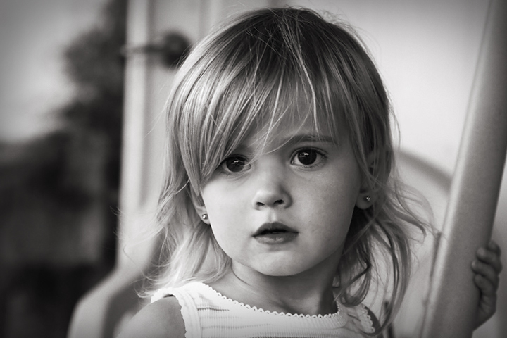 young girl by a door