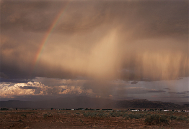 Desert storm at sunset