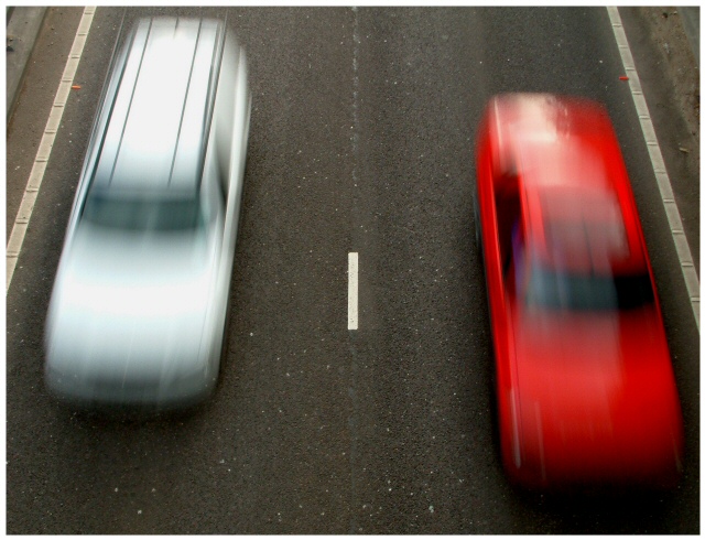 Two cars at speed