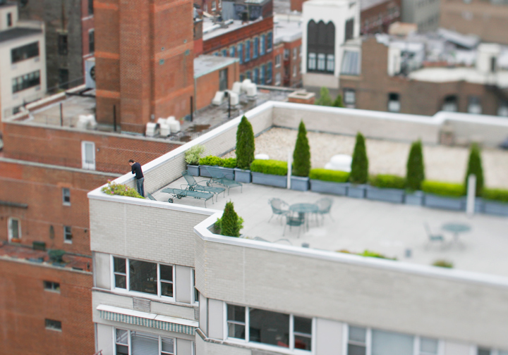 Man Looking Over Ledge