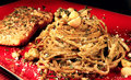 Lemon grass crusted salmon with Macadamia nut pesto linguine