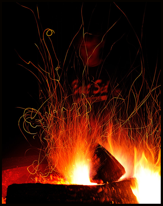 Young Apprentice Tending Fire