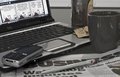 Tools of business - laptop, mobile phone, lots of coffee and Dilbert