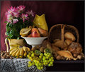 Une Nature Morte avec Fruits, Pains et Fleurs