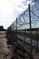 no pavement, just chain link and razor wire