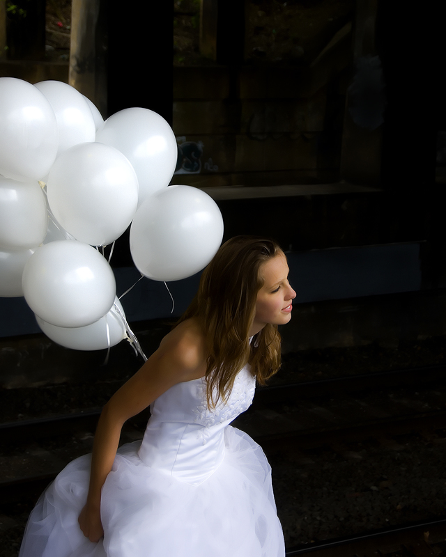 She looks ahead happily, her life in front of her, carefree and beautiful....