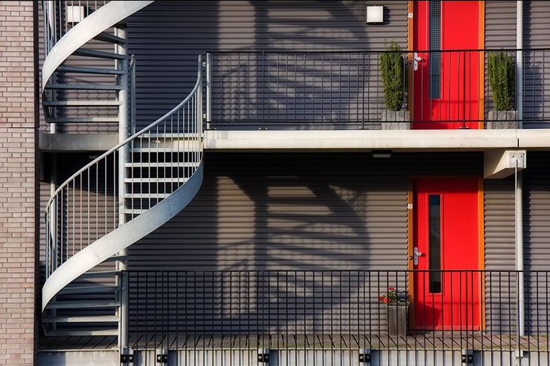 The fire escape, the shadow and the red doors